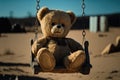 Lonely abandoned old teddy bear on swing with rusty chains