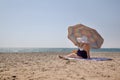 Lonely adult woman on the beach