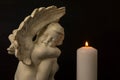 Lonely angel as a symbol of death and the end of human life. Free copy space for design or text. Royalty Free Stock Photo