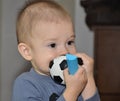 Lonely baby with a ball Royalty Free Stock Photo