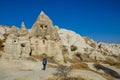 Lonely backpacker tourist walks in empty Cappadocia cave city