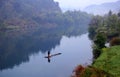 Lonely bamboo rafts floated on the calm lake Royalty Free Stock Photo