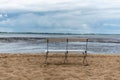 A lonely bank on a beach at ebbe Royalty Free Stock Photo