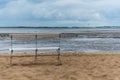 A lonely bank on a beach at ebbe Royalty Free Stock Photo