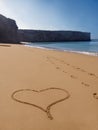 Lonely beach heart-shape in sand Royalty Free Stock Photo