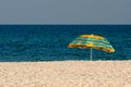 Lonely beach umbrella on a deserted sea beach