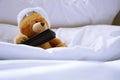 Lonely bear in bed