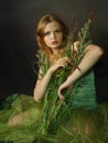 The lonely beautiful girl with a grass Royalty Free Stock Photo