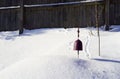 Lonely bell silenced in winter snow