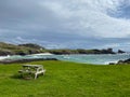 Lonely bench on the Clachtoll Beach in Lochinver, Scotland