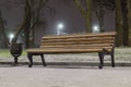 Lonely bench covered with snow at night Royalty Free Stock Photo