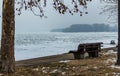 Lonely bench in front of frozen Danube Royalty Free Stock Photo
