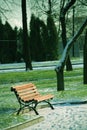 Lonely bench in the park early winter Royalty Free Stock Photo