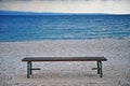 Lonely bench at the sea coast Royalty Free Stock Photo