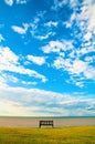 Lonely bench on the sea Royalty Free Stock Photo