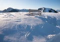 Lonely bench on a snow field, and carved love heart. mountain top in the bavarian alps