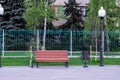 Lonely bench. A vacant riverside bench on a sunny evening Royalty Free Stock Photo