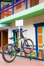 Lonely bicycle parked on a colorful rack at the beautiful Guatape