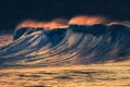 Lonely big wave breaking at sunset Royalty Free Stock Photo