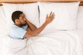 Lonely black man sleeping in bed and missing his partner Royalty Free Stock Photo