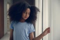 Lonely black teen girl leaved alone at home care depressed mental sick from child abuse domestic violence problem Royalty Free Stock Photo