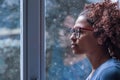 Sad african american girl looking out of the window Royalty Free Stock Photo