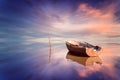 Lonely boat and amazing sunset at the sea Royalty Free Stock Photo