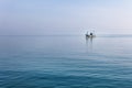 Lonely boat at Andaman blue sea in calm weather, Thailand Royalty Free Stock Photo
