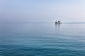 Lonely boat at Andaman blue sea in calm weather, Thailand