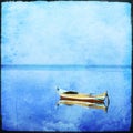 Lonely boat with grunge texture