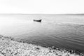 Lonely boat in the middle of the ocean Royalty Free Stock Photo