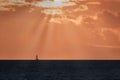 Lonely boat in the pacific ocean at the sunset in Maui, Hawaii Royalty Free Stock Photo