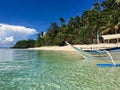 A lonely boat on the paradise sandy beach,with clear water, Phil