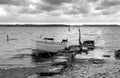 Lonely boat at quay. Sunset scenic landscape. black and white