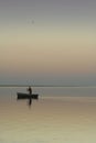 Lonely boat on silent water. sunset Royalty Free Stock Photo