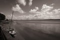 A lonely boat sits on the river Mersey waiting for the tide to come back Royalty Free Stock Photo