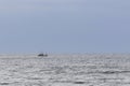 Lonely boat in a storm in the sea.