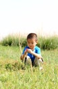 Lonely boy in the field Royalty Free Stock Photo