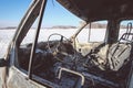 Lonely burnt car on a suburban highway