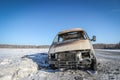 Lonely burnt car on a suburban highway