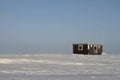 Lonely cabin in a snow landscape on the arctic tundra