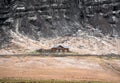 Lonely cabin under the rock