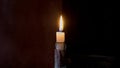 Lonely candle on a dark background Royalty Free Stock Photo