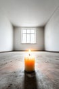 Lonely candle in minimalist empty room with natural light from window Royalty Free Stock Photo