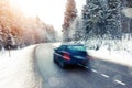 Lonely car driving in winter landscape Royalty Free Stock Photo