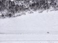 Lonely car on snowy road. Royalty Free Stock Photo