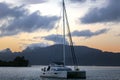 Lonely catamaran at sunset near Tahaa island Royalty Free Stock Photo