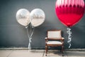 A lonely chair decorated with balloons the only sign of a celebration