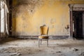 a lonely chair in a desolate, dust-covered ballroom