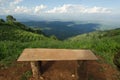 Lonely chair with grass, mountain and cloudy sky view of Chiangmai Thailand Royalty Free Stock Photo